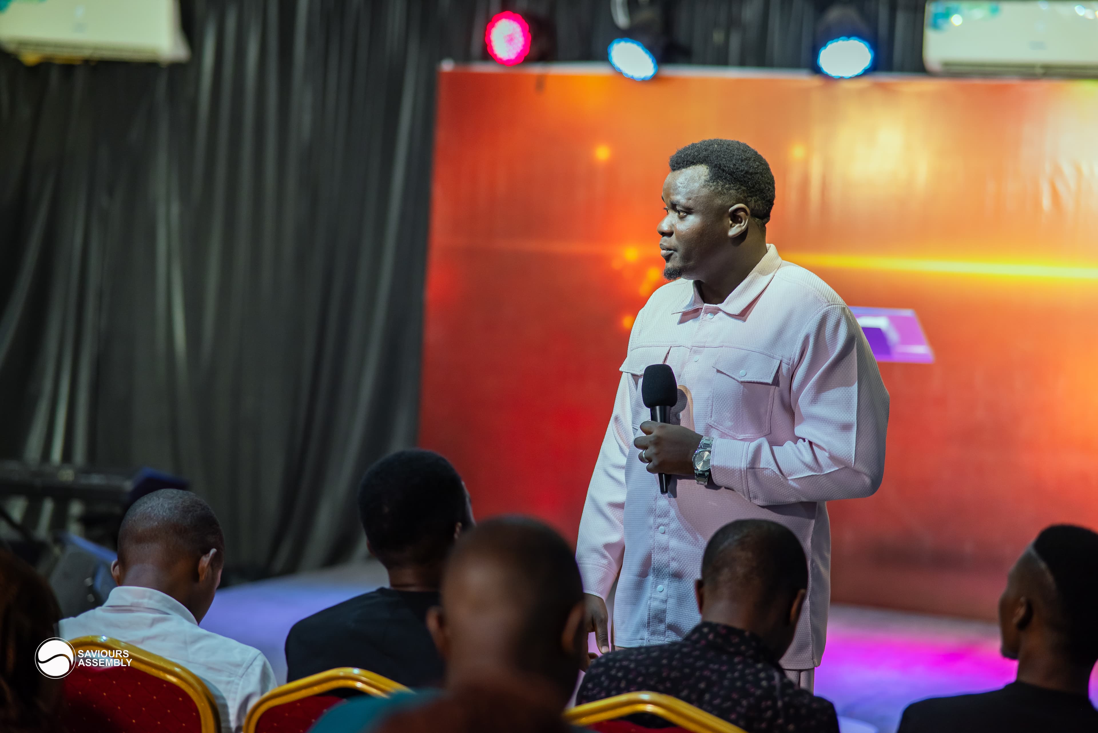 Pastor Henry Odewale during a worship gathering