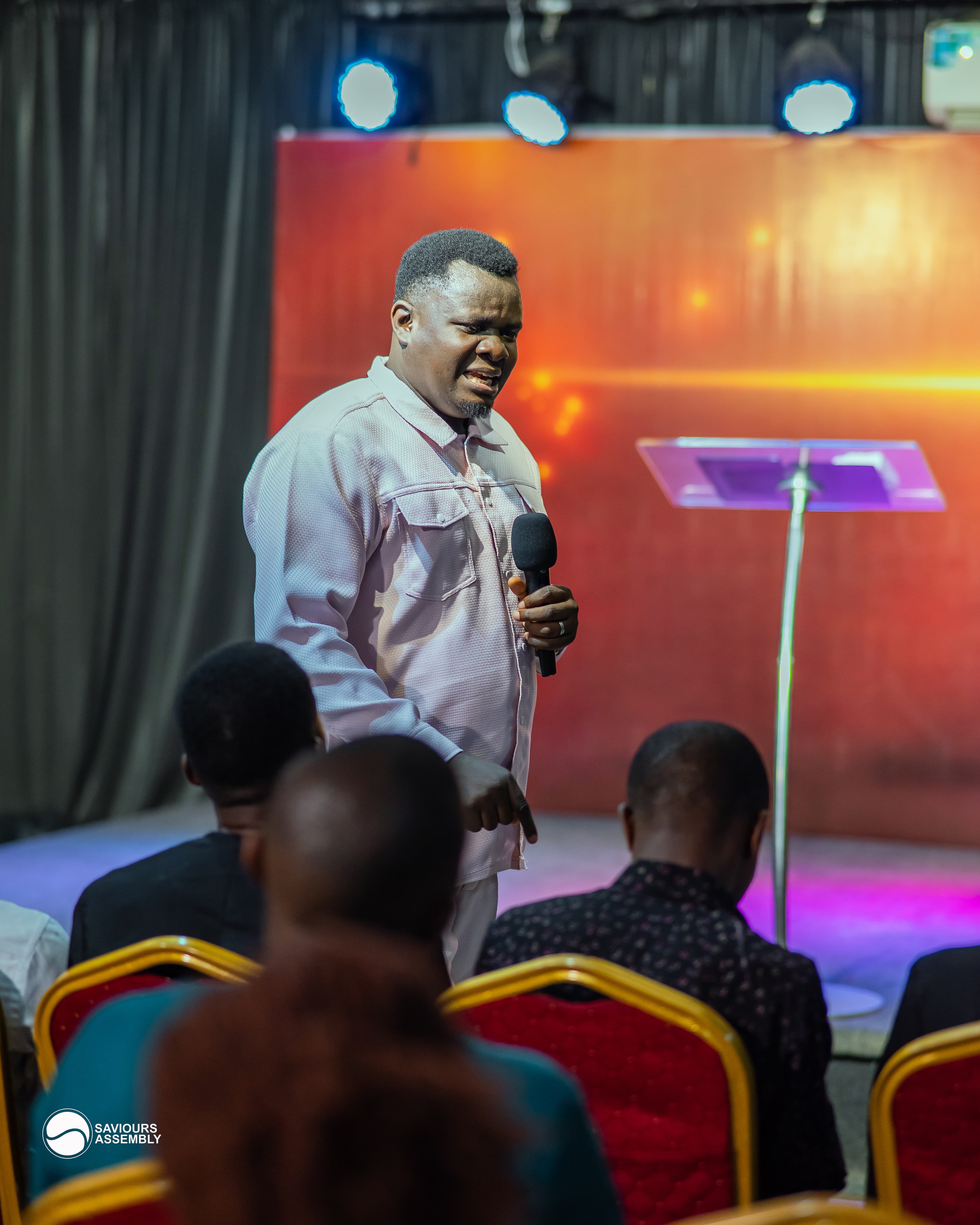 Pastor Henry teaching during a ministry gathering