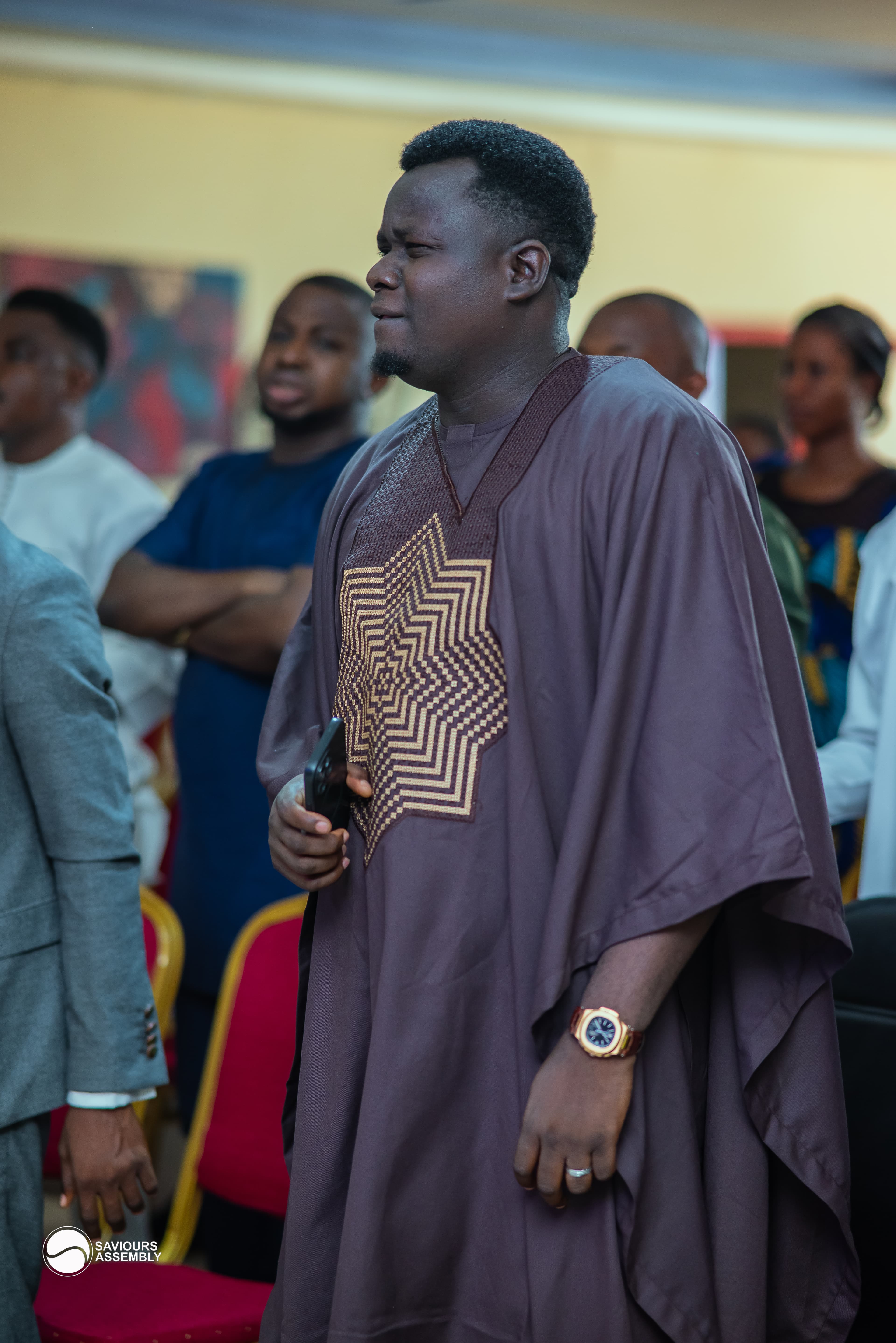 Pastor Henry Odewale ministering during a Sunday service